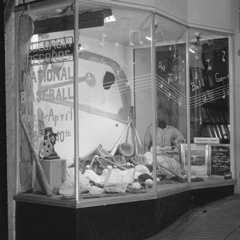 The front window of Hodgin's Store (electronics and sporting goods) in Woodstock, Va. Window advertises National Baseball Week, April 3-10. 4