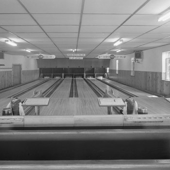 Inside of a bowling alley, a view from further back 2