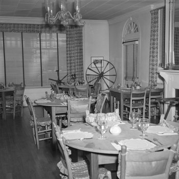 Inside the Lee-Jackson Hotel, view of the dining area, with a spinning wheel in the background. New Market, Va.