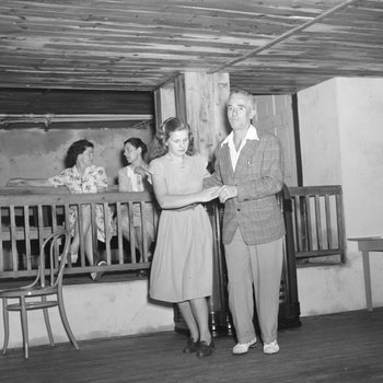 Inside of the Shenandoah Alum Springs Hotel, a group of people socializing and dancing. Orkney Springs, Va. 2