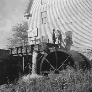 Bryce's Mountain Resort, side view of two men standing on the water wheel. Basye, Va. 2