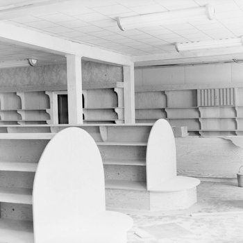 Empty shelving inside of a store or building.