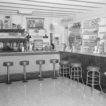Inside of a store, with a view of the refreshment counter.