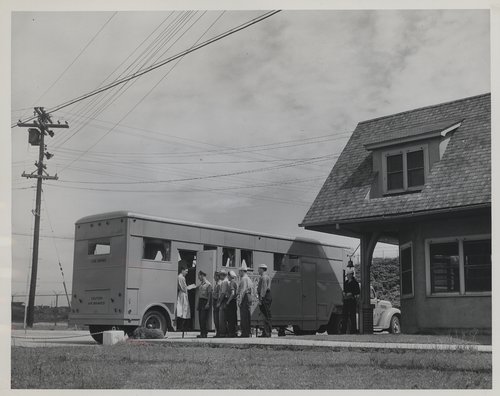 Sailors at the U.S. Naval Magazine in Montauk, New York, wait in line at a mobile dental unit for treatment in 1945.