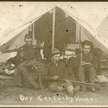 Three soldiers outside their tent labeled "Our Kentucky Home" (SC2014.83.1)