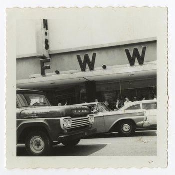 Automobiles and Spectators Outside F.W. Woolworth and Co. Building