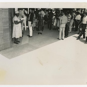 Crowd of Spectators Gathered Outside F.W. Woolworth and Co. Building