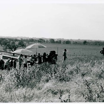 "The Learning Tree" crew setup for an exterior scene while Gordon Parks, Jr. surveys the area on location in Bourbon and Linn counties, Kansas