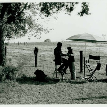 Gordon Parks works with a staff member of "The Learning Tree" crew while on location in Bourbon and Linn counties, Kansas