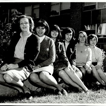 Six Students in the Grass Near White Hall, Student Groups, ca. early 1960s