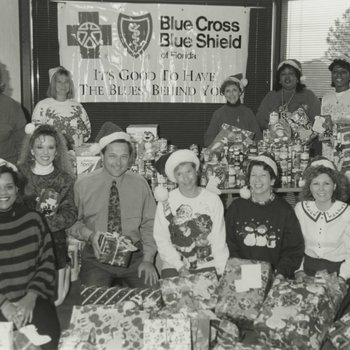 Employees Posing with Donations