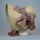 Bonnet, cream and ivory silk with deep brim and salmon ribbon, c. 1830s-1840s, full side view