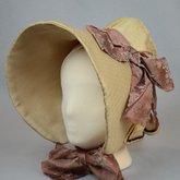 Bonnet, cream and ivory silk with deep brim and salmon ribbon, c. 1830s-1840s, side-front view