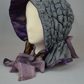 Hood, steel blue quilted silk, c. 1840s, side-front view