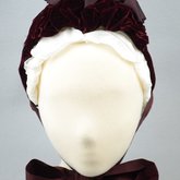 Bonnet, gray felt capote with burgundy velvet and ribbon, and jet beads on a net, 1880s, front view