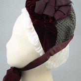 Bonnet, gray felt capote with burgundy velvet and ribbon, and jet beads on a net, 1880s, side view