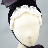 Bonnet, deep purple velvet with a peaked brim and purple silk ribbons, mid-1880s, front view