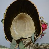 Bonnet, natural straw woven into lace with pink roses and plaid ribbon ties, 1880s, interior view