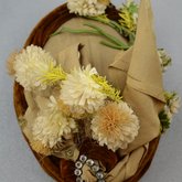 Toque, oval shape with cream ribbon, brown velvet, and artificial flowers, 1890s, top view