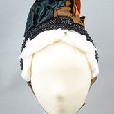 Bonnet, brown velvet capote with jet trim and teal, brown, and orange satin ribbons, 1880s, front view