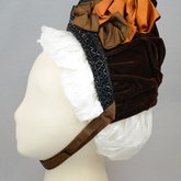Bonnet, brown velvet capote with jet trim and teal, brown, and orange satin ribbons, 1880s, side view