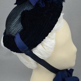 Bonnet, blue straw capote with velvet trim and feather puffs, 1870s-1880s, right side view