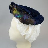 Toque, blue velvet with rhinestones and feathers, 1890s, left side view