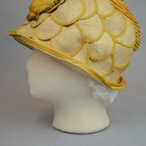 Cloche, yellow silk with raffia accents, 1920s, left side view