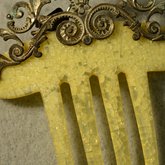 Comb, yellow with brass, late 19th century, detail of crystallization