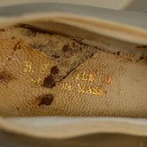 Shoes, white satin with strap, 1920s, detail of label