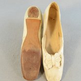 Shoes, white kidskin slippers with pinked bow, 1860s, top and sole view