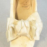 Shoes, white kidskin slippers with ribbon bow, 1860s-1870s, detail of bow
