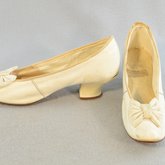 Shoes, white kidskin slippers with kidskin bow, 1879, side and front view