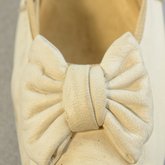 Shoes, white kidskin slippers with kidskin bow, 1879, detail of bow