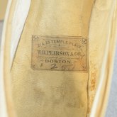 Shoes, white kidskin slippers with kidskin bow, 1879, detail of label