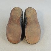Children's shoes, black leather with strap, early 20th century, top and sole view