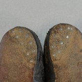 Children's shoes, black leather with strap, early 20th century, detail of sole repair