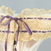 Pink silk corset, 1890-1905, detail of lace with ribbon