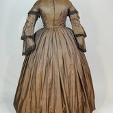 Dress, brown silk with black fringe trim, 1853-1863, front view