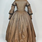 Dress, brown silk with black fringe trim, 1853-1863, back view