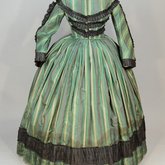Dress, green taffeta plaid silk with black silk pleated trim, 1853-1863, front view