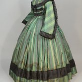 Dress, green taffeta plaid silk with black silk pleated trim, 1853-1863, side view