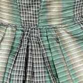 Dress, green taffeta plaid silk with black silk pleated trim, 1853-1863, detail of skirt alterations at waist