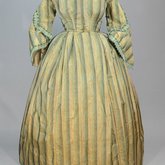 Dress, green and tan striped silk with woven trim, 1853-1863, front view