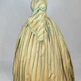 Dress, green and tan striped silk with woven trim, 1853-1863, side view