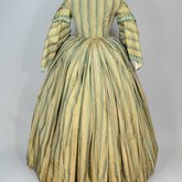 Dress, green and tan striped silk with woven trim, 1853-1863, back view