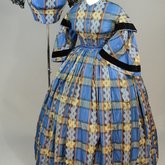 Dress, blue, yellow, and black plaid silk, with both day and evening bodices, 1860s, front-side view