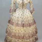 Dress, paisley-printed mull with fan-front bodice and tiered skirt, 1863, front view