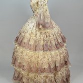 Dress, paisley-printed mull with fan-front bodice and tiered skirt, 1863, side view
