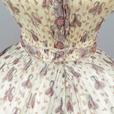 Dress, paisley-printed mull with fan-front bodice and tiered skirt, 1863, detail of front waist